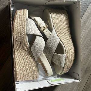Size 7.5 Vanilla coloured Michael Koars Mid wedge shoes.